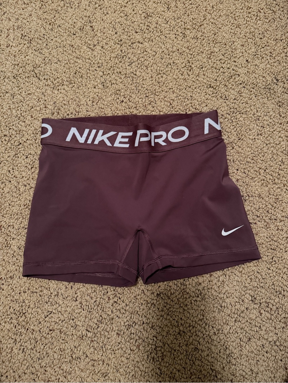 Nike Pro Women's Burgundy Bike Shorts with White Logo